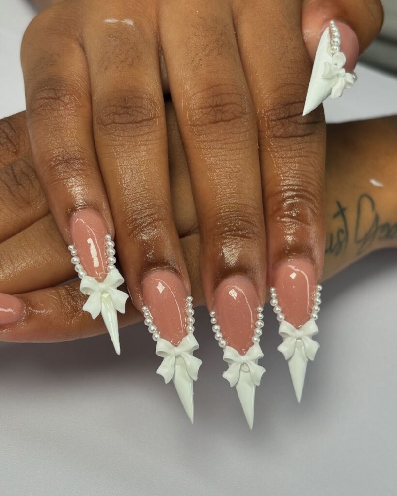 White Bow nails in stiletto shape