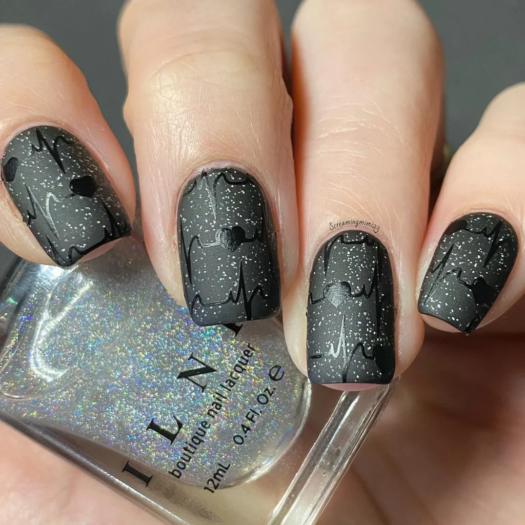 Chunky glitter black heartbeat nails