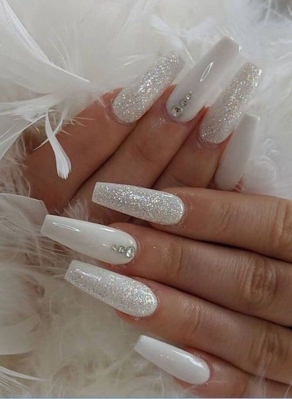 Glittery white nail art