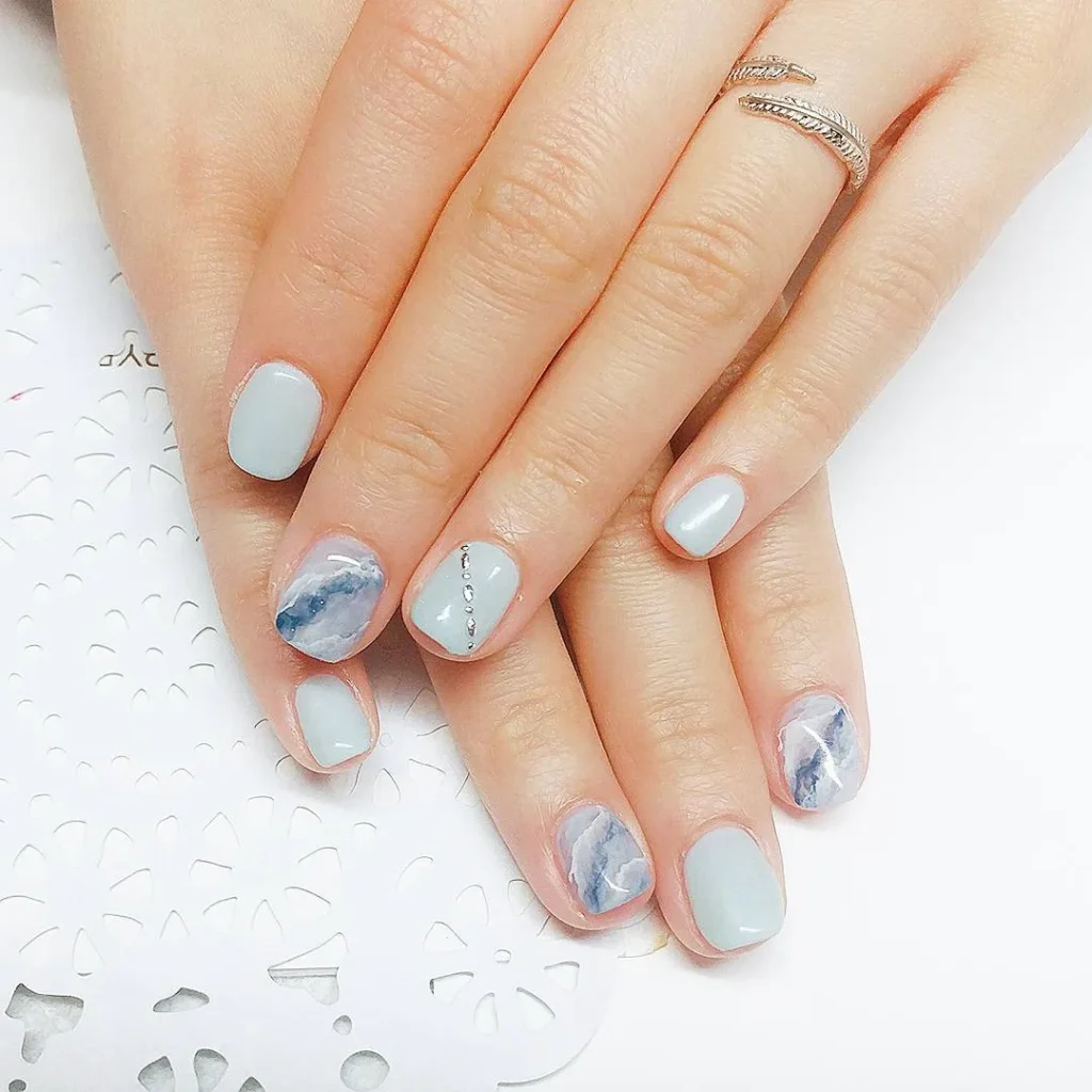 Light blue marble nail art