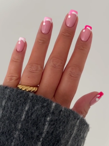 Pink and white santa french tip nail art