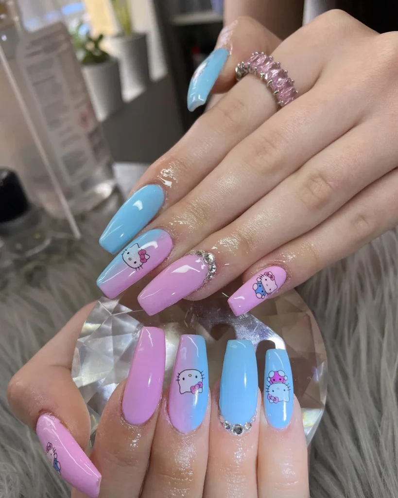 Light pink and blue hello kitty acrylic nail design