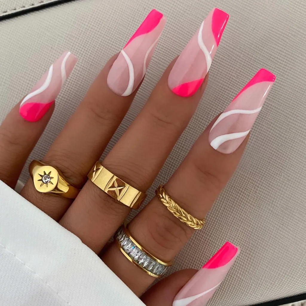 Neon pink and white swirls on acrylic nails