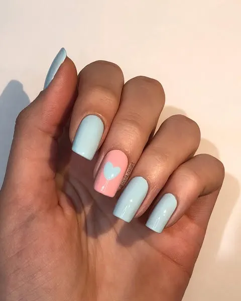 Pale pink and blue heart nails