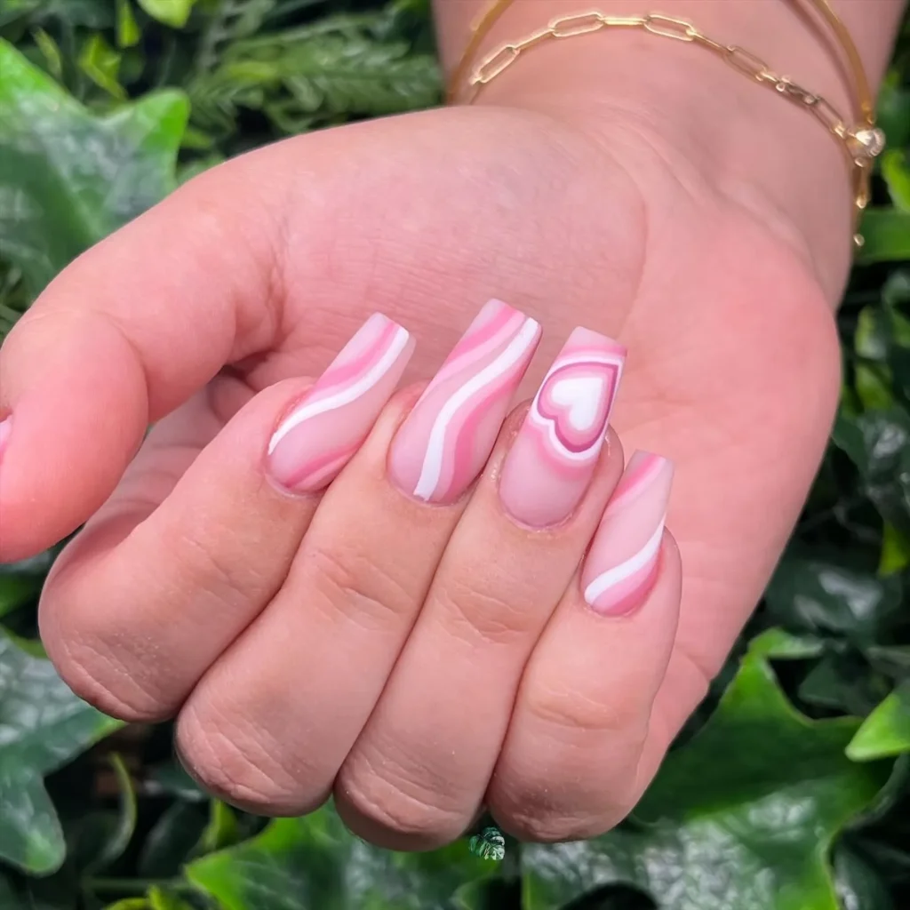 soft pink swirl nail set with a layered heart