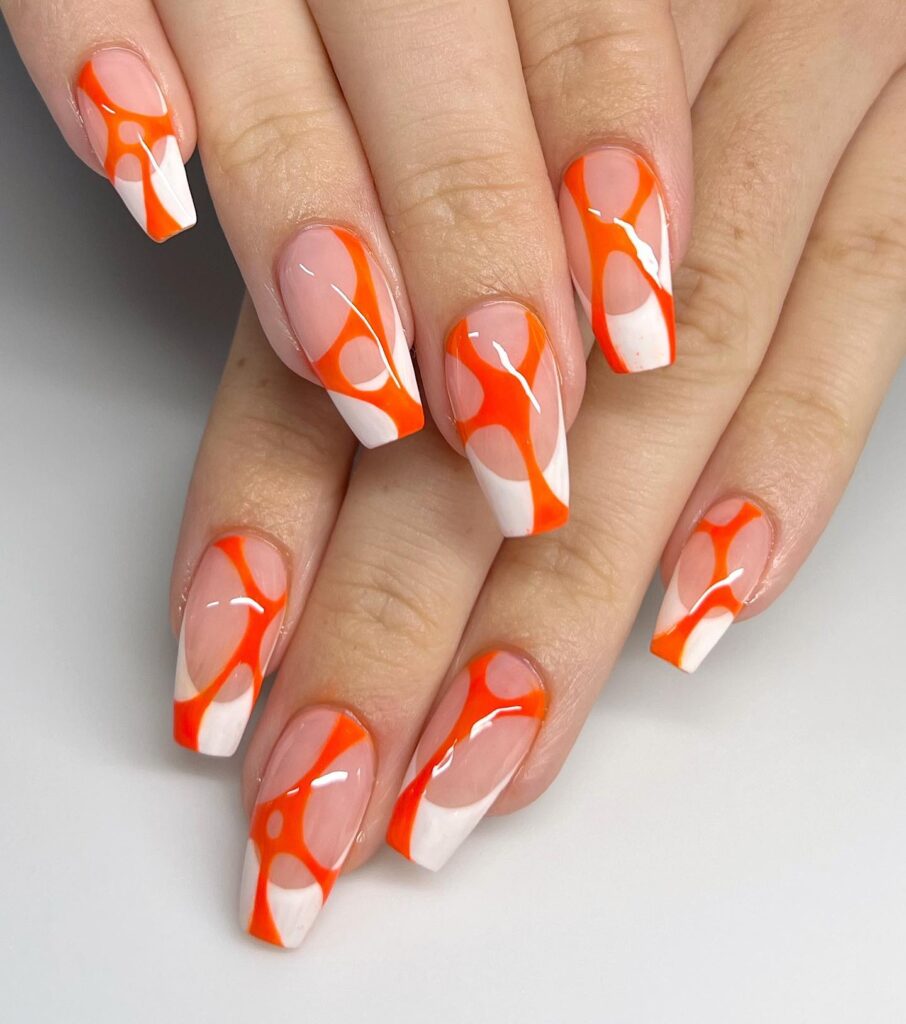 Orange and white Web nail design
