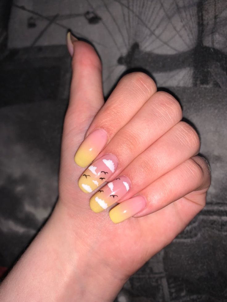 light yellow nails with cloud nails