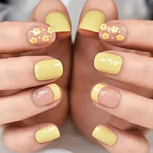 Pastel yellow nail art with floral