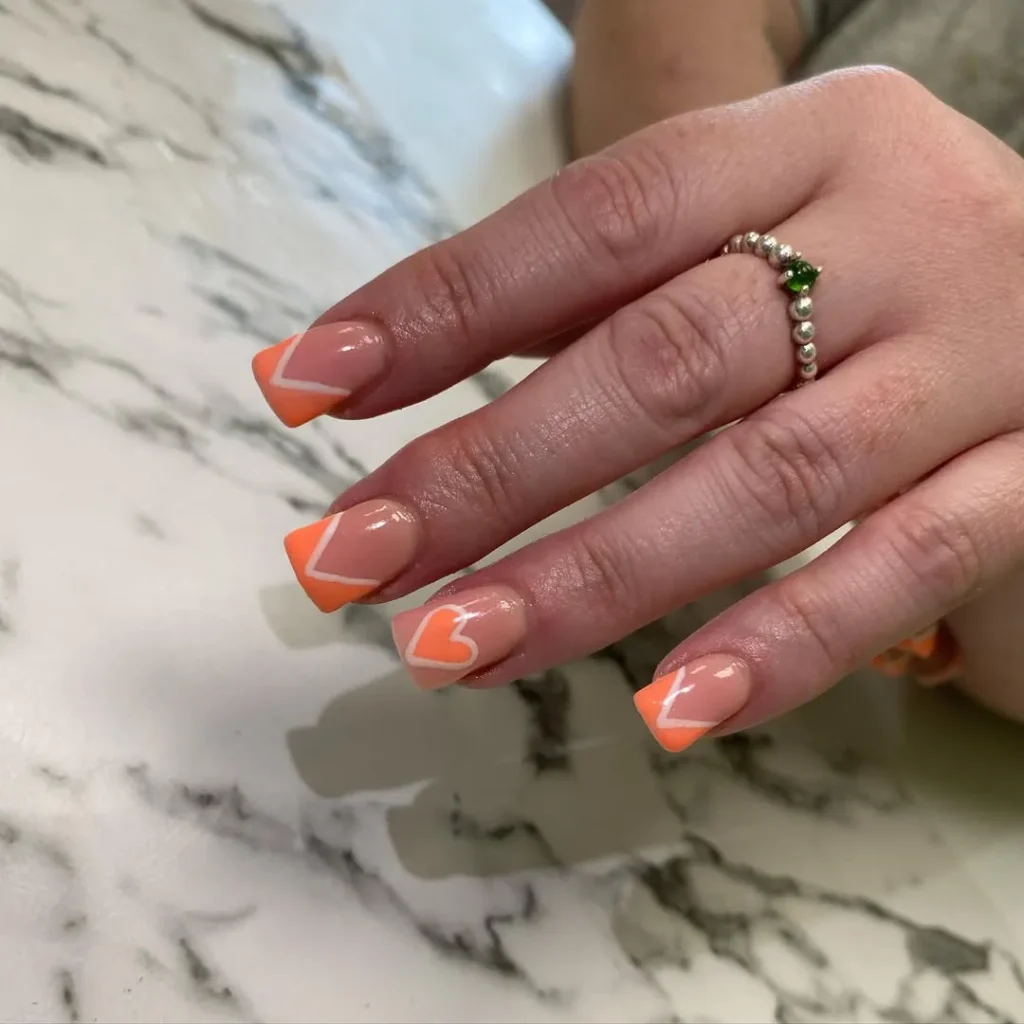 orange and white heart nails in square shape