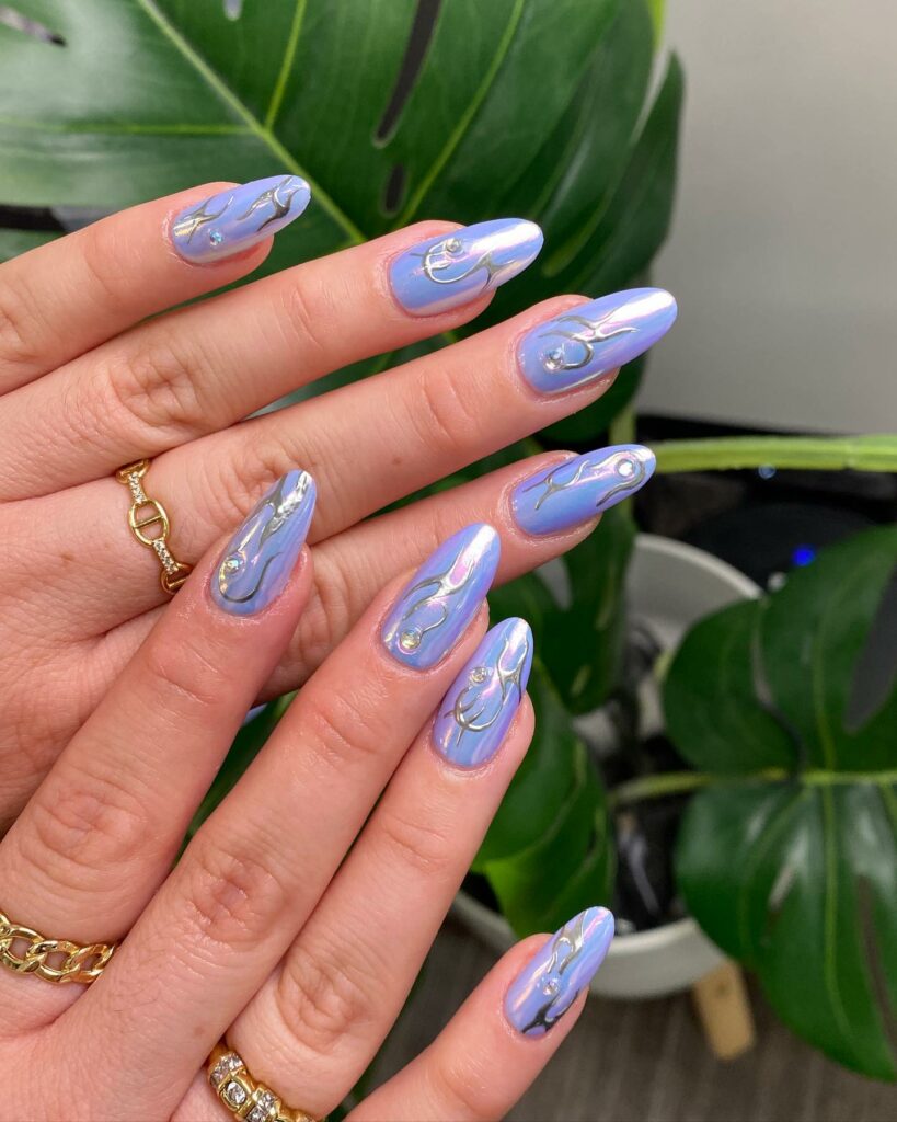 Blue nails with metallic accents