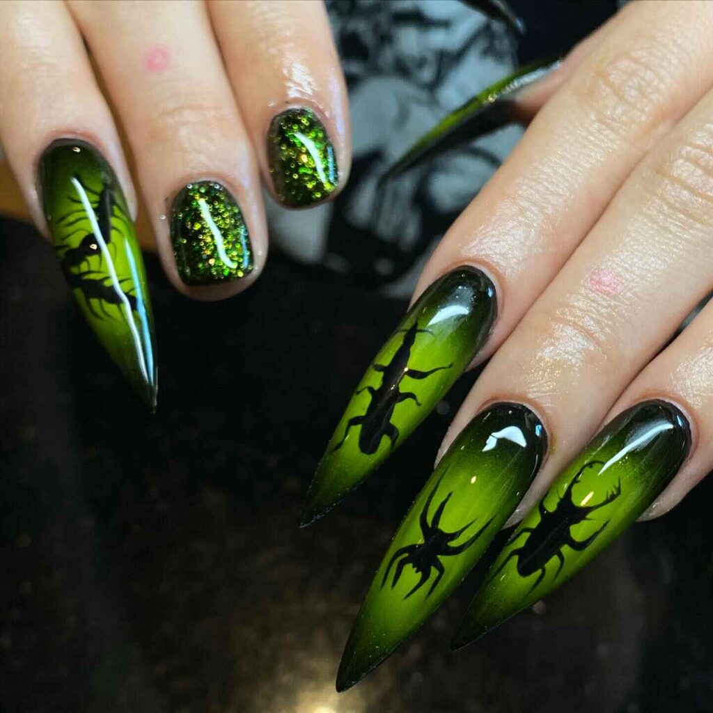 Black and green airbrush nail art with bug accent