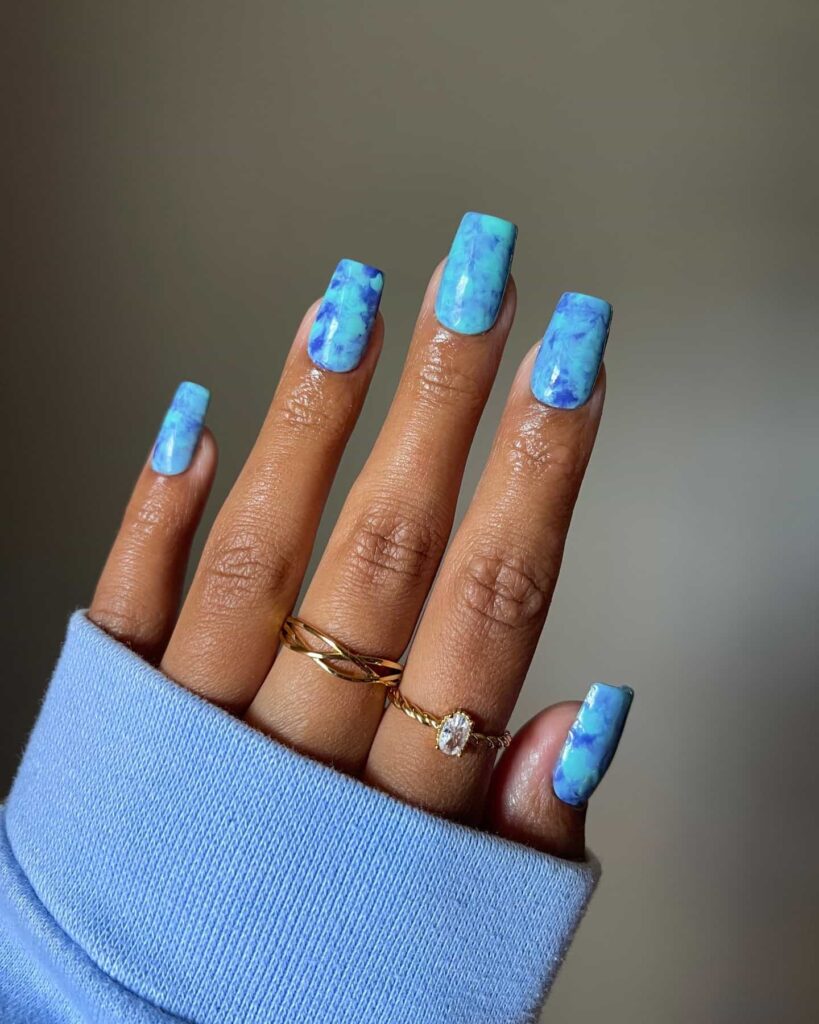 Coffin shaped blue marble nails