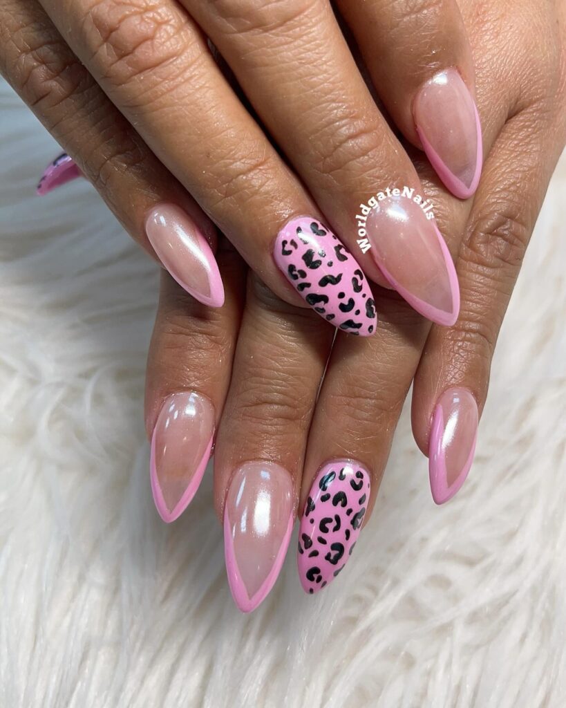 Milky pink nails with leopard spots and a chrome finish.