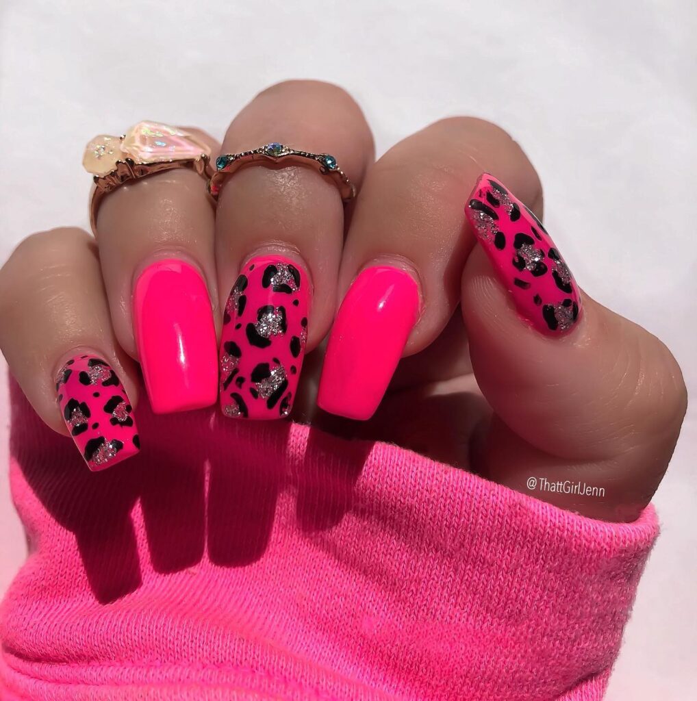 Neon pink nails with glitter leopard print