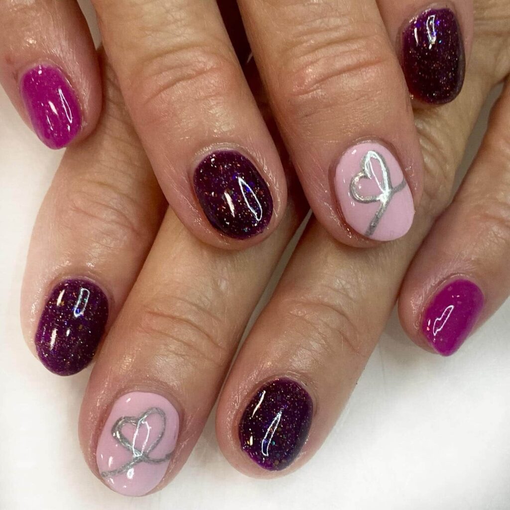 Heart nail design in deep purple