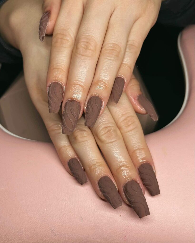 brown textured swirl nail design