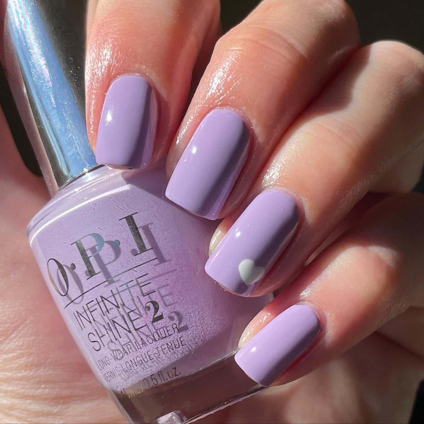 Short lilac nails with little white heart