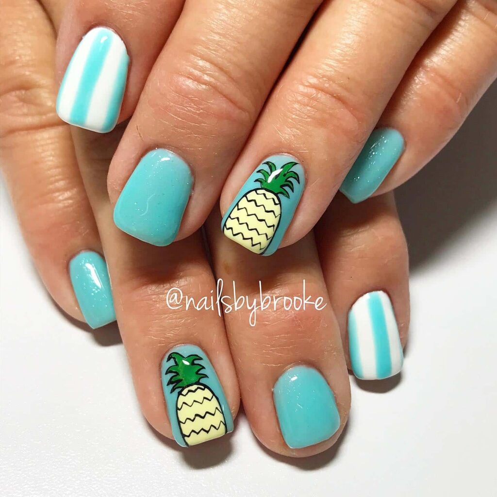 Beach nail art with pineapple accent