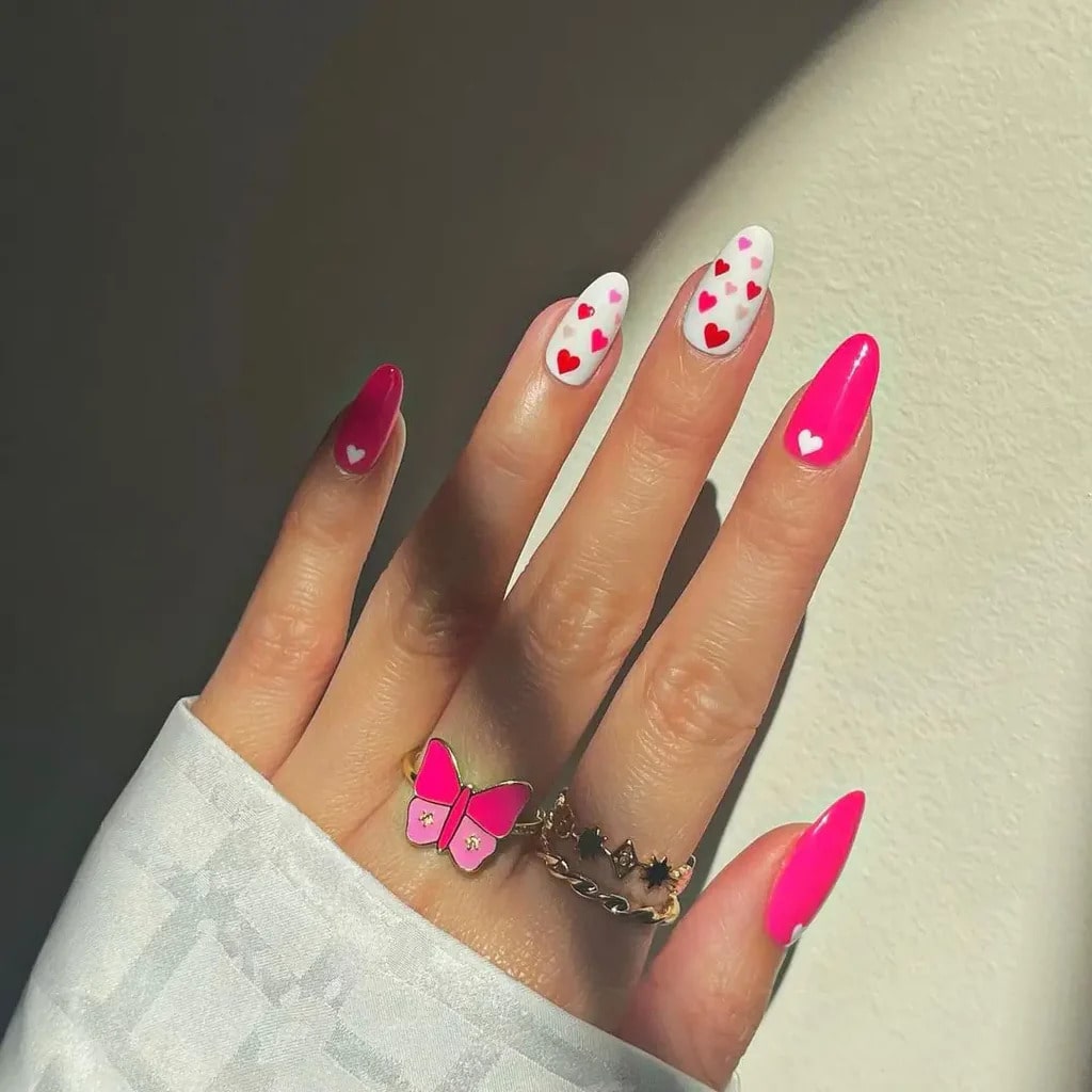 Bright pink and white heart nails