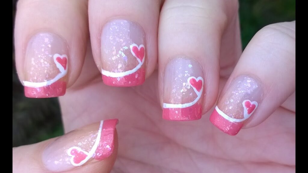 French tip nails with pink hearts