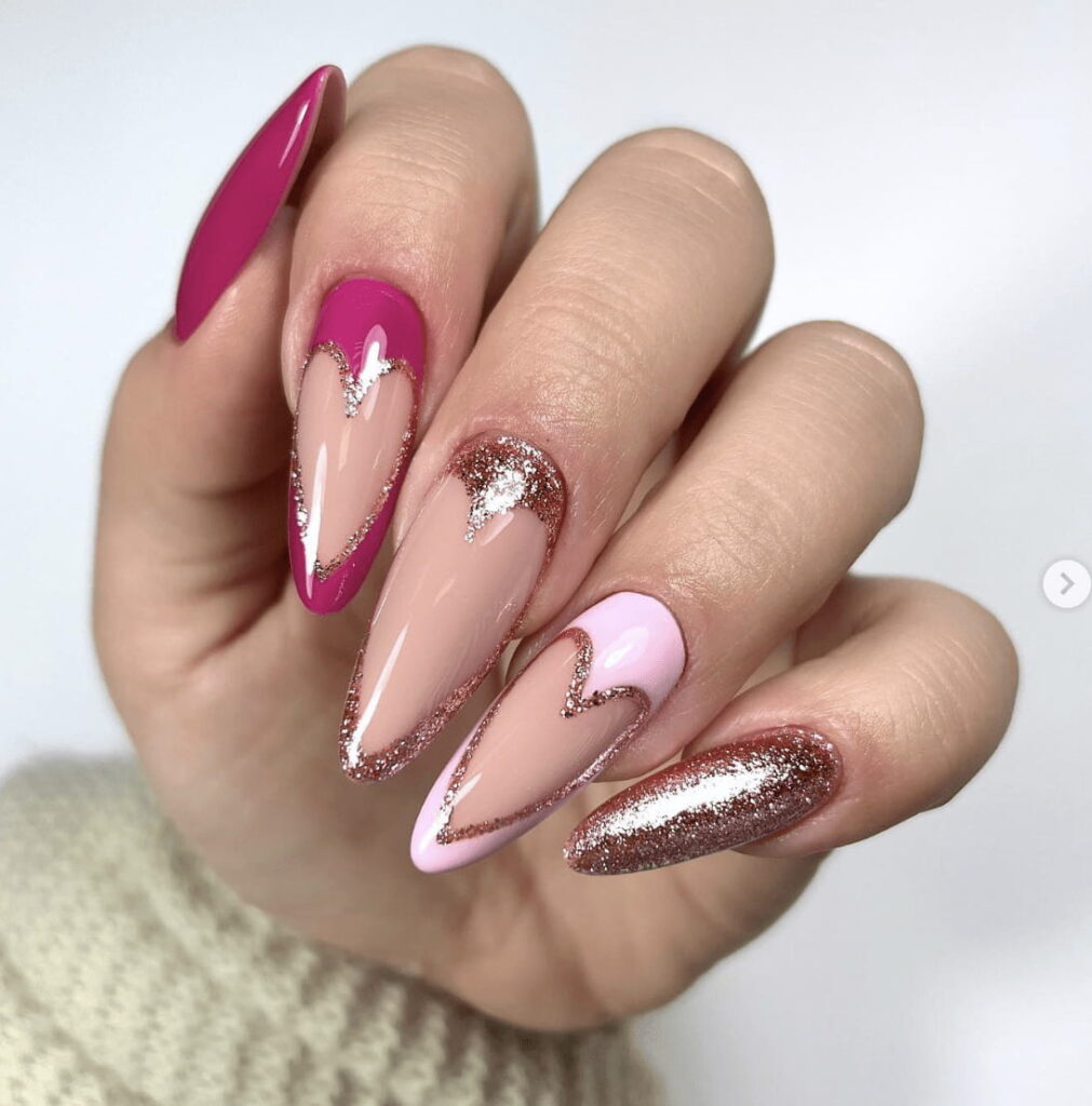 Long stiletto nails with glitter hearts