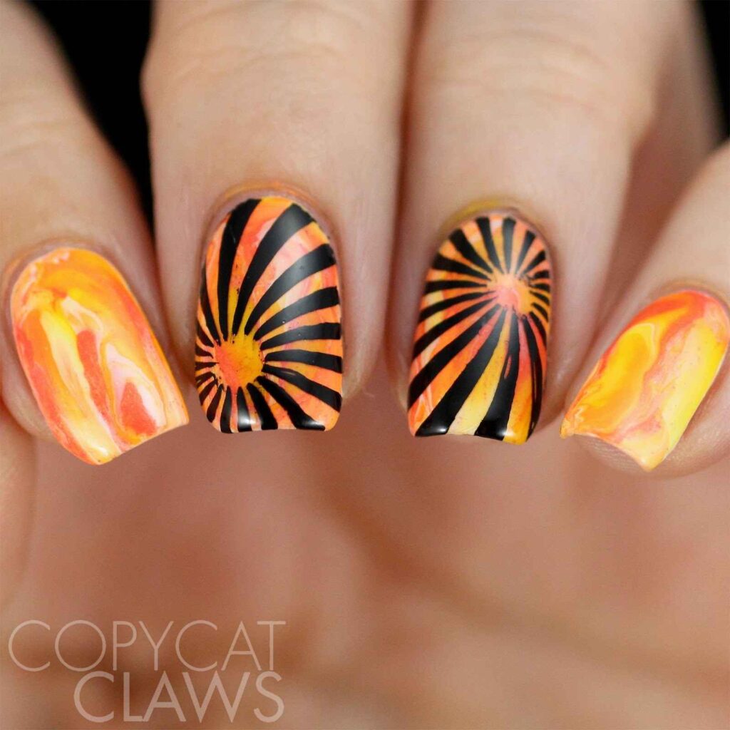Orange and black sunshine nail art