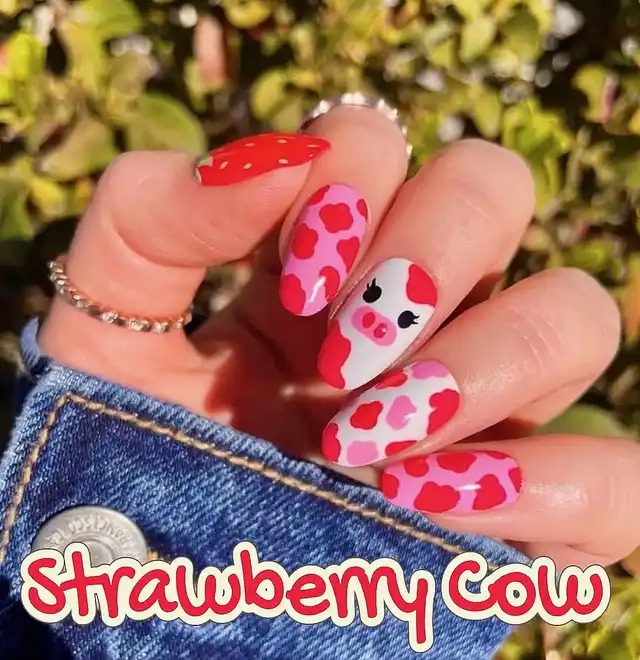 Pink and red cow print nails