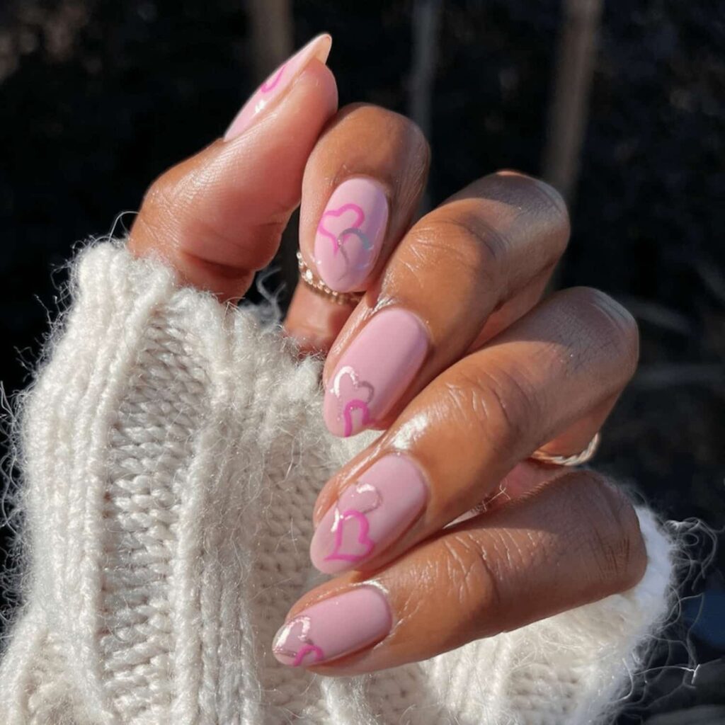 Pink nails with outline hearts