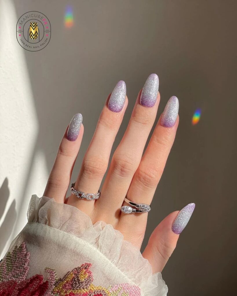 Purple and silver ombré nails with silver glitter fading from cuticle to tip