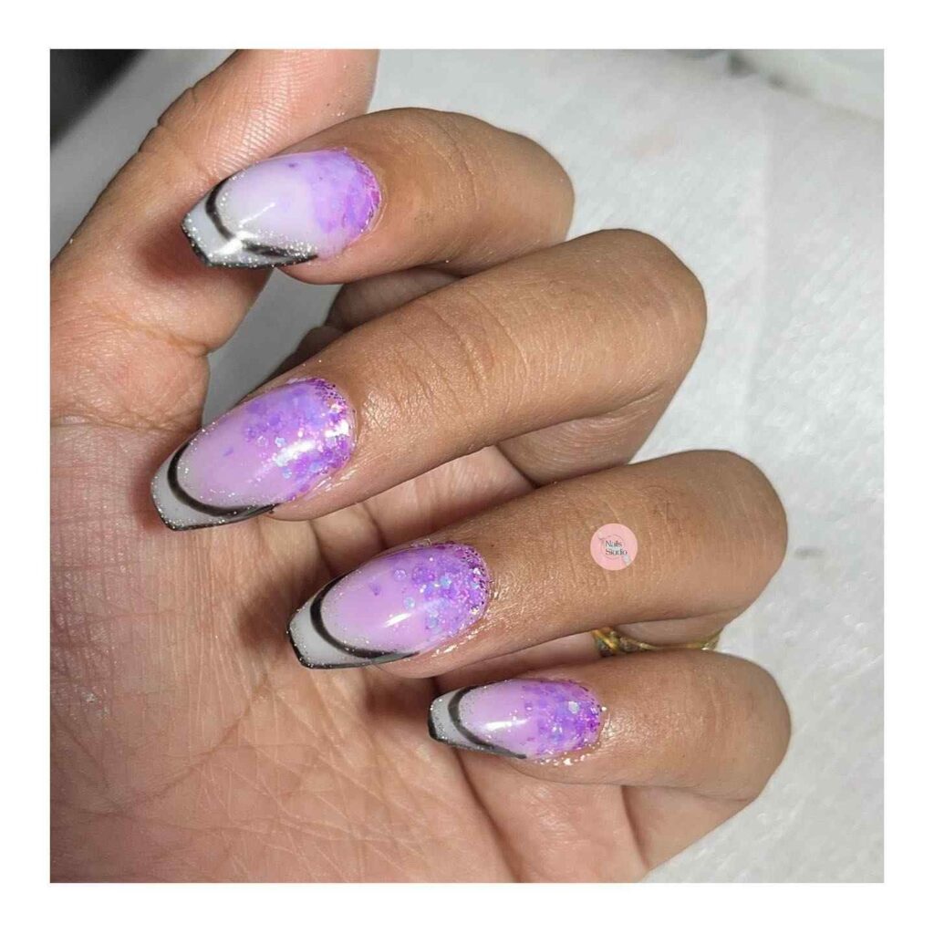 Purple glitter and black tip nails