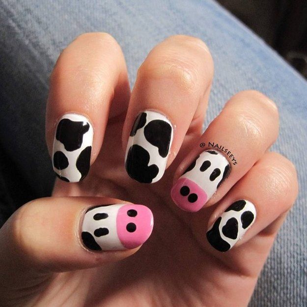 cute cow print nail art in black, pink and white