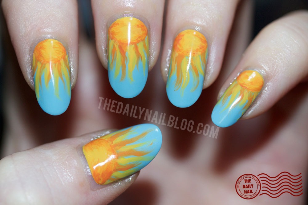 sun nail art over blue sky