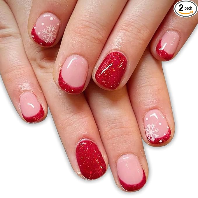 Short glitter red nails with snowflake accent