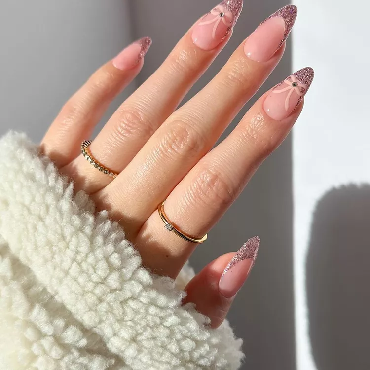 almond shape nails with glitter tips
