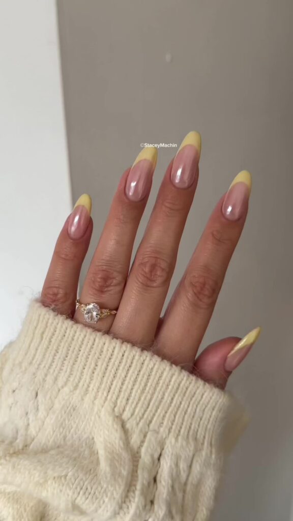pastel yellow french tip nails with glazed donut effect