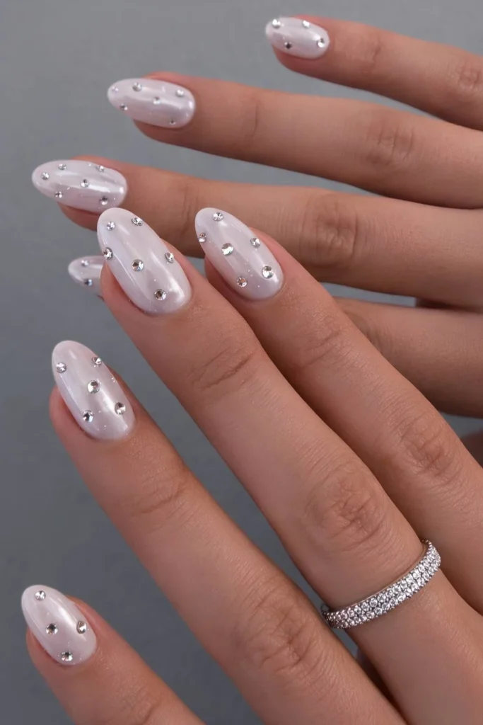 white chrome nails with rhinestones