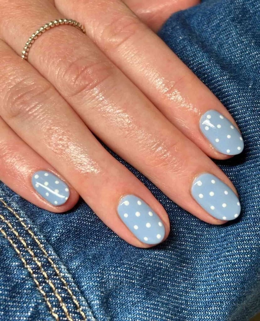 Polka dot nails in cornflower blue color